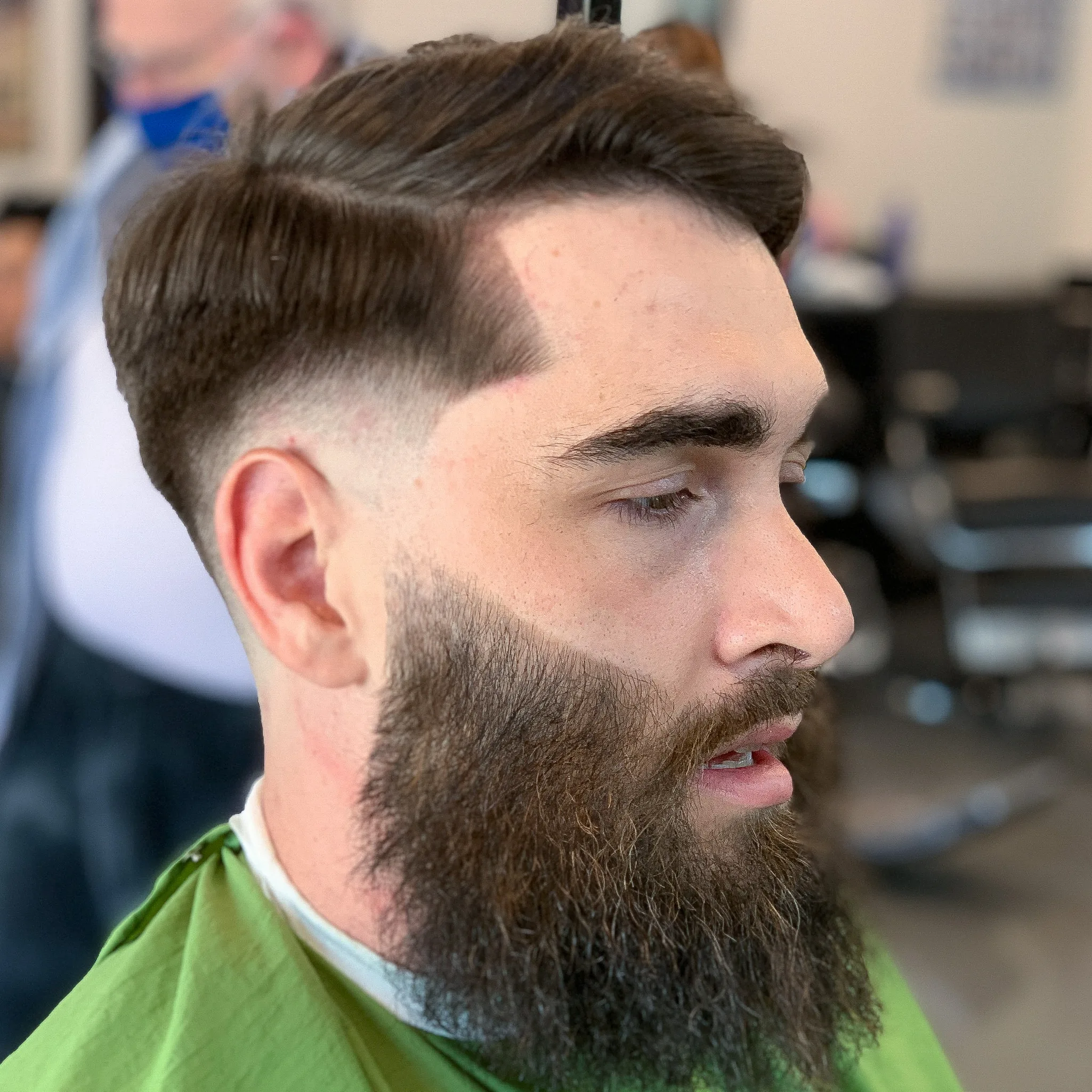 Fresh skin fade haircut with sharp beard trim at GG101 barbershop in Kyle, TX