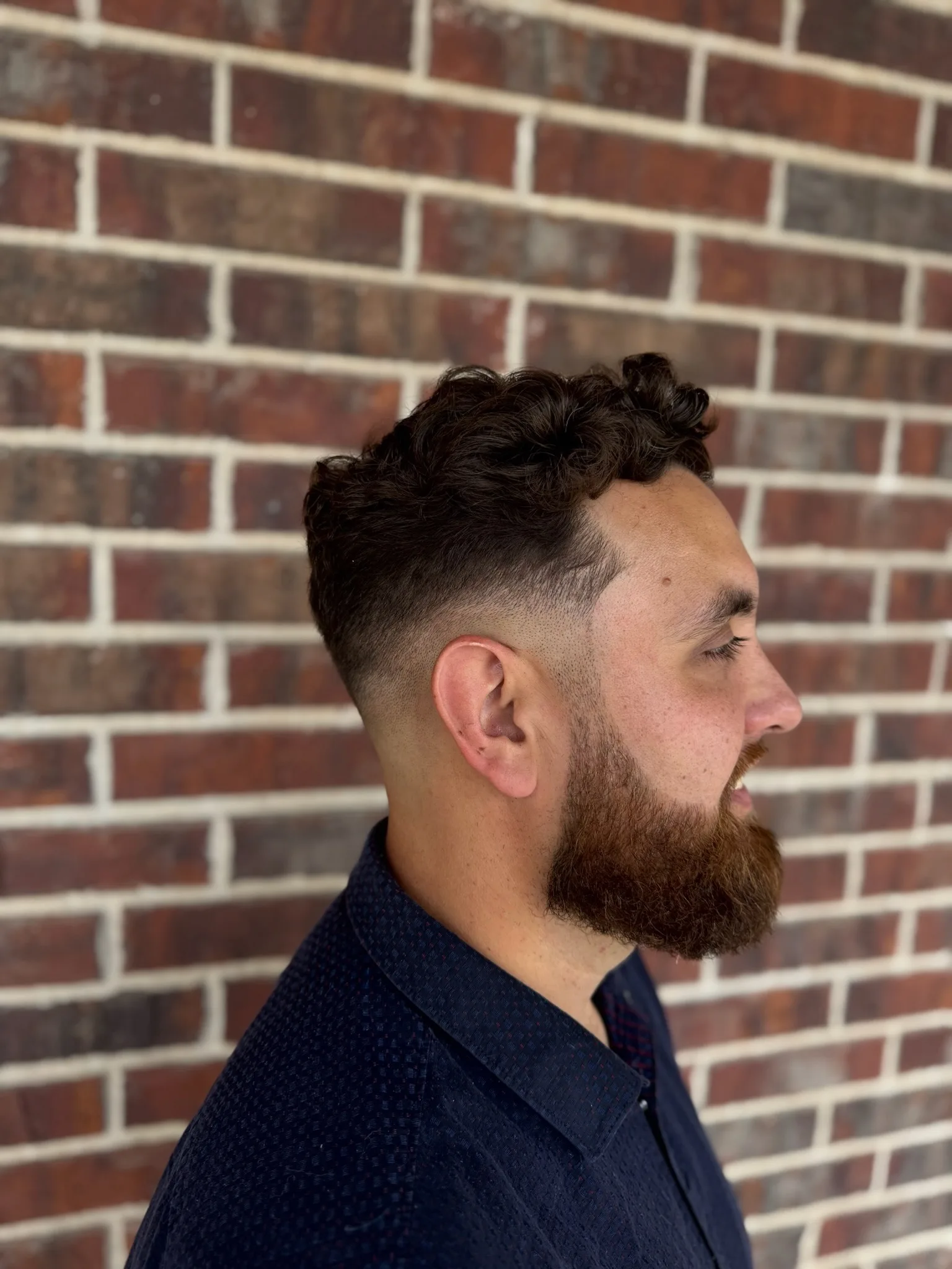 Fade haircut for men's hair at Gentlemen's Grooming 101 in Kyle, TX